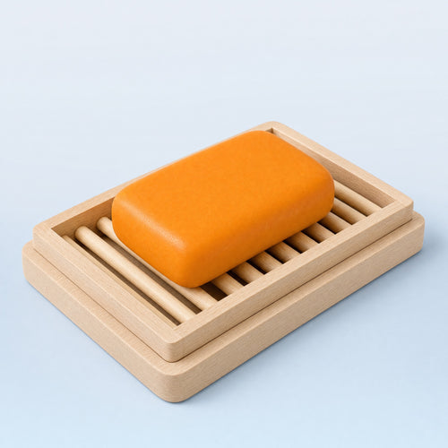 Wakai beech wood two-layer slatted soap dish with an orange Wakai bar resting on the rack